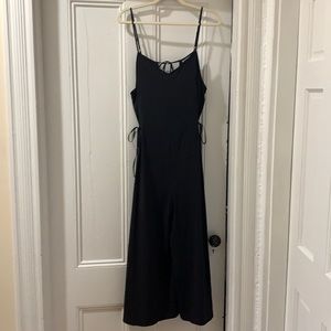Athleta black jumpsuit w side-ties, size 14
